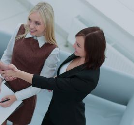 Three business people shaking hands in agreement